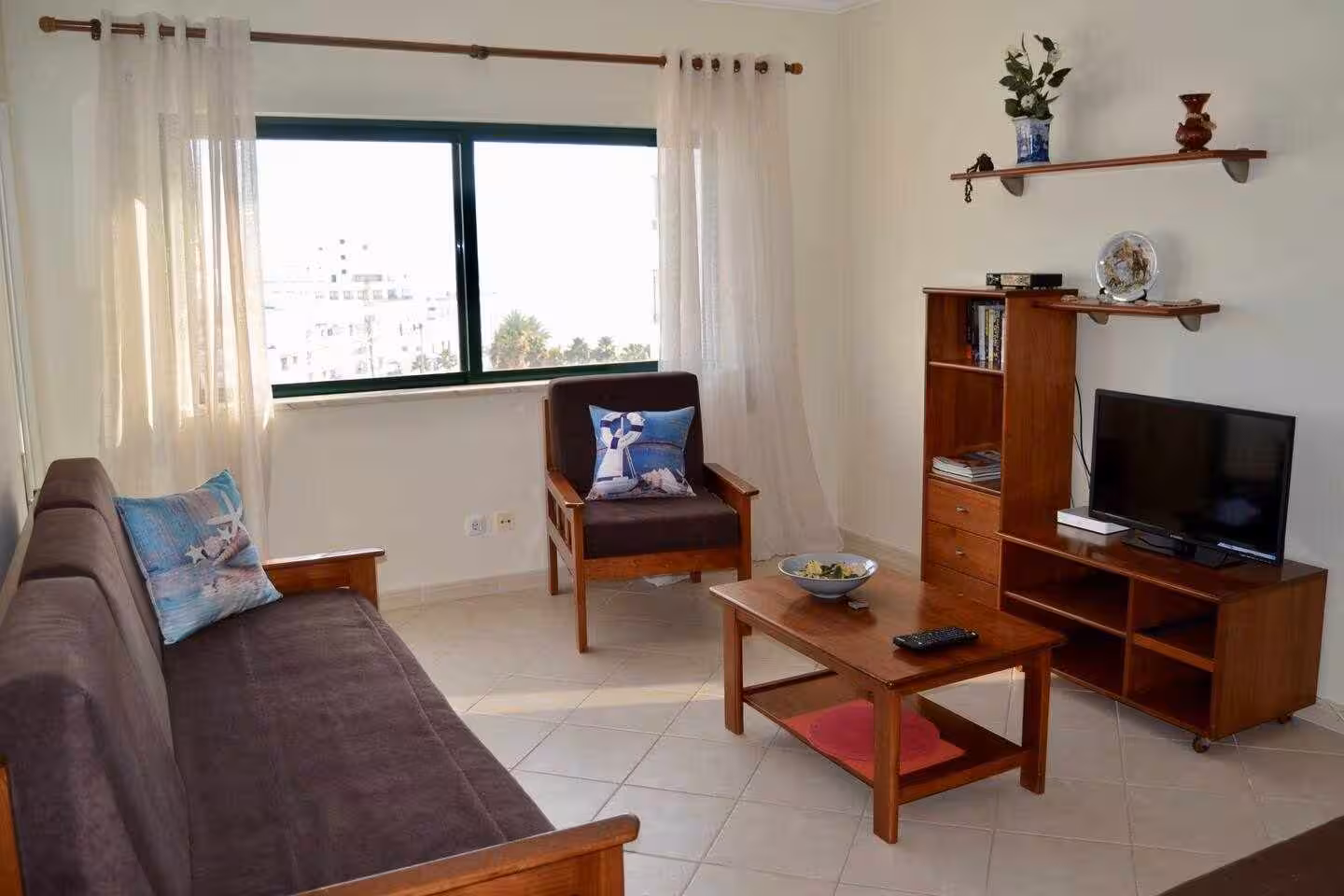 Sala com cama de solteiro